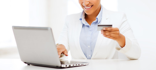 Image showing businesswoman with laptop and credit card