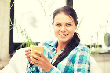 Image showing lovely housewife with mug