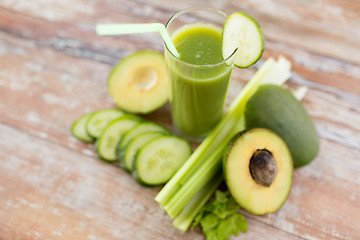 Image showing close up of fresh green juice glass and vegetables