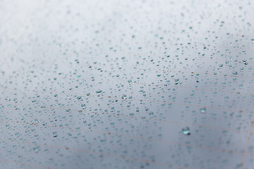 Image showing close up of wet rear car glass