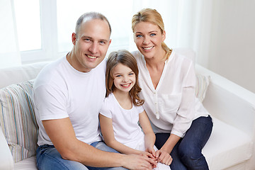 Image showing happy parents with little daughter at home