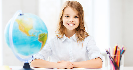 Image showing student girl with globe at school