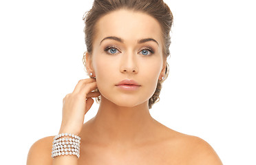 Image showing woman with pearl earrings and bracelet