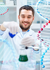 Image showing scientist with test tubes making research in lab