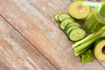 Image showing close up of fresh green juice glass and vegetables