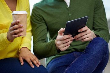 Image showing close up of students with tablet pc and coffee