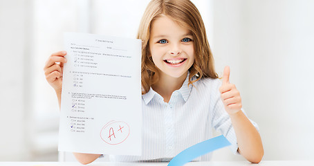 Image showing girl with test and grade at school