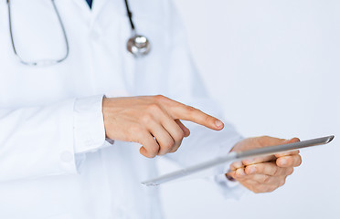 Image showing male doctor holding tablet pc