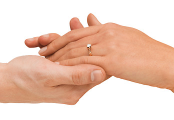 Image showing man puts wedding ring on woman hand