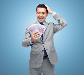 Image showing happy laughing businessman with euro money