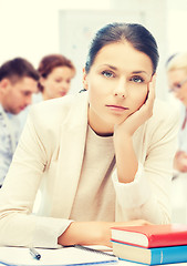 Image showing stressed businesswoman in office