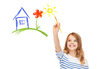 Image showing cute little girl drawing house with brush