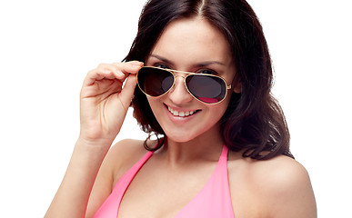 Image showing happy woman in sunglasses and swimsuit