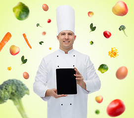 Image showing happy male chef cook showing with tablet pc