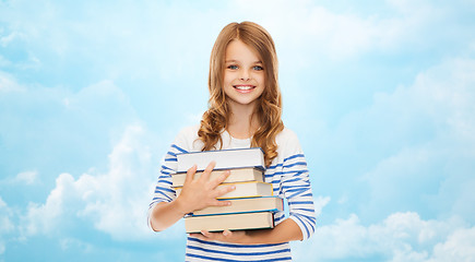 Image showing happy little student girl with many books