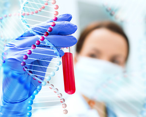 Image showing close up of scientist holding test tube in lab