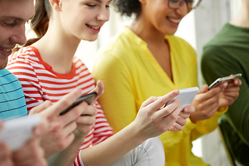 Image showing close up of students with smartphones at school