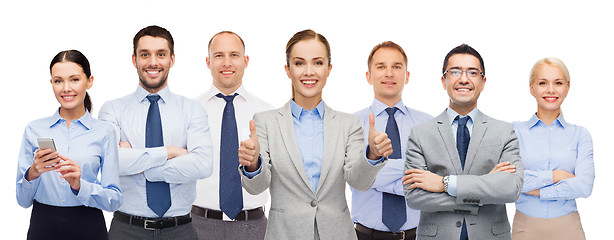 Image showing group of happy businesspeople showing thumbs up