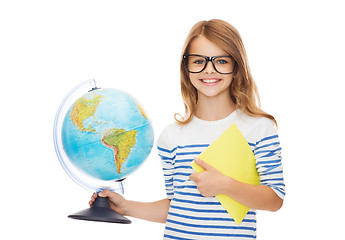 Image showing smiling child with globe, notebook and eyeglasses