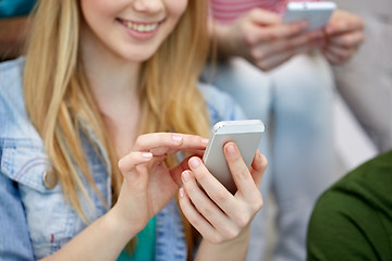 Image showing close up of female hands with smartphone