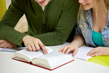 Image showing close up of students reading book or textbook