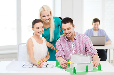 Image showing smiling architects working in office