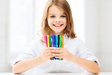 Image showing girl showing colorful felt-tip pens