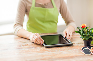 Image showing close up of woman or gardener with tablet pc