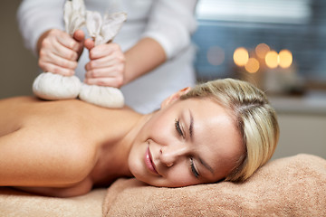 Image showing close up of woman lying on massage table in spa