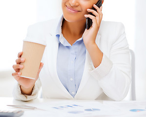 Image showing african businesswoman with smartphone in office