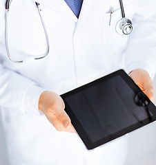 Image showing male doctor holding tablet pc