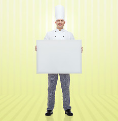 Image showing happy male chef cook holding white blank big board