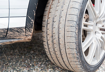 Image showing close up of dirty car wheel on ground