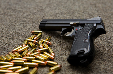 Image showing pistol and bullets