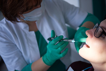 Image showing woman patient at the dentist