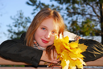 Image showing Girl with autumn leaves