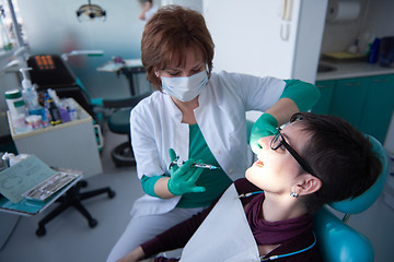 Image showing woman patient at the dentist