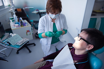 Image showing woman patient at the dentist