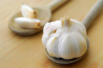 Image showing Garlics and spoons