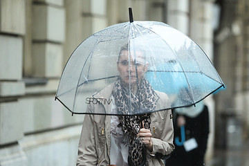 Image showing Woman with umbrella on street