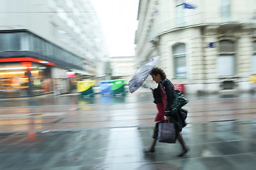 Image showing Motion of woman in a rain 