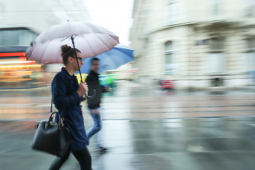 Image showing Woman and man in the rain