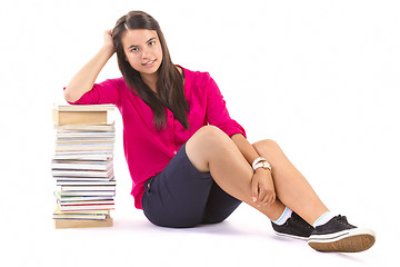 Image showing young student girl with stack of books on withe