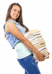 Image showing young student girl holding a stack of books