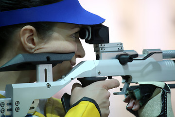 Image showing woman aiming a pneumatic air rifle