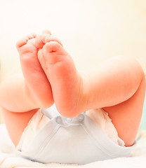 Image showing Baby boy with feet in the air after diaper change and bath