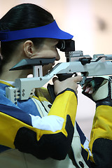 Image showing woman aiming a pneumatic air rifle