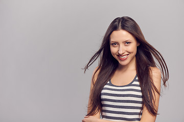 Image showing Happy woman with flying hair