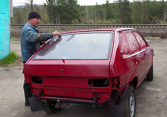 Image showing Paint the car with their hands