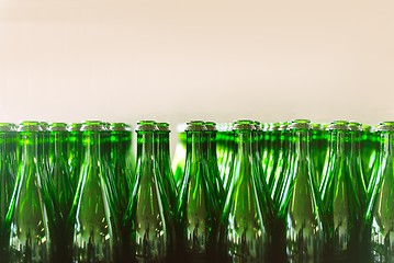 Image showing Many bottles on conveyor belt